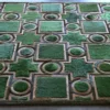 The Ignition Hide 16101 luxury designer rug showcases a geometric green pattern and high-end handmade hide craftsmanship.