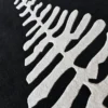 Luxury custom wool rug with white fern motif, ideal for sophisticated high-end interiors.