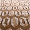 Close-up of luxury custom designer rug with textured beige and white hexagon patterns in handmade silk and wool.