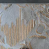 Close-up of the Hide 29827 luxury designer rug, showcasing high-end handmade hide with silver and gold abstract patterns.
