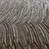Close-up of overlapping brown and white feathers inspires this luxury designer custom hide rug.