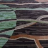 Luxury designer wool rug with abstract brown, green, and beige lines on dark.