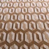 Close-up of a luxury custom designer rug, handmade wool and silk, with beige and white hexagonal geometric pattern.