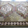 Winterlude Hide 26020 is a luxury designer rug featuring geometric patterns and earthy tones in a high end handmade hide rug style.