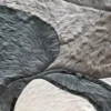 Abstract close-up of gray, white, and brown fur for luxury handmade designer hide rugs.