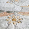 Close-up of a luxury designer hide rug with a floral pattern from the Sweet Hide 26095 collection.