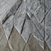 Gray and beige handmade hide rug with geometric, quilt-like luxury designer pattern.