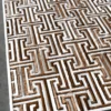 Ripcord Hide 27036 is a luxury designer rectangular rug with geometric maze pattern, raised white borders, and brown and white hide sections.