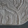 Close-up of luxury designer Aubusson Hide 16290, a handmade wool and hide rug in beige and brown.