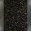 Luxury designer rug featuring dark diagonal strips in geometric sections, wall-mounted.