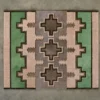 Luxury designer rug features beige, green, and gray geometric motifs on smooth gray floor.