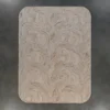 Aubusson Hide 16290 designer rug: luxury handmade hide rug with raised abstract waves on beige, on dark grey floor.