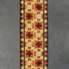 Luxury designer handmade hide rug with red star and yellow geometric pattern, bordered by vibrant triangles.