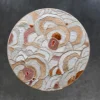 Bloom Hide 16038 luxury designer rug with textured abstract circles in beige, pink, white, and rust on dark gray.