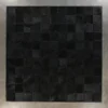 Promenade Hide 30151 luxury designer rug with textured black squares on a light grey wall.
