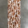 Luxury designer Quiver Hide 14869 handmade hide rug with a brown and white chevron pattern on a gray floor.