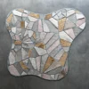 Luxury designer rug with irregular mosaic pattern in beige, gray, and tan on grey.
