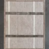 Luxury designer rectangular beige custom rug with silk and wool, gray stripes, on dark floor.