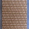 Luxury custom wool and silk designer rug features a tan hexagonal pattern on gray floor.