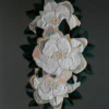 Three white flowers with yellow centers grace this high end designer rug, Sweet Hide 26095.