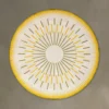 Shadowplay Hide 26287 high end designer rug with yellow-green sunburst on gray.