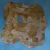 Portal Hide 25165 luxury designer rug, handmade hide, layered brown with central hole on blue background.