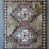 Luxury designer Winterlude Hide 26020 handmade rug, geometric and floral patterns in rich multicolor with star motifs and elegant borders.
