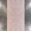The Urushi Wool 28585 is a luxury designer rug with a pink and white abstract pattern on a gray floor.