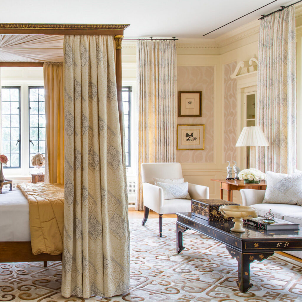 Elegant bedroom with a canopy bed and luxury designer rug enhancing the sophisticated decor.