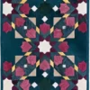 This luxury designer rug showcases a geometric pattern on blue with vibrant accents, ideal for high end interiors.