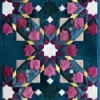 Kasbah Hide 15910 luxury designer rug with geometric pink, white, and gold shapes on dark teal.