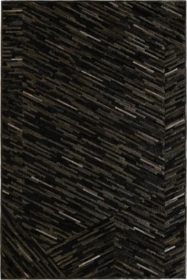 Luxury custom hide rug with geometric dark brown and black lines, designer abstract high-end appearance.