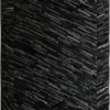 Luxury custom rug with a textured surface and dark geometric lines, ideal for high end designer interiors.