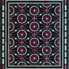 Luxury designer rug tile with maroon floral pattern, green leaves, black ground, Aubusson-inspired handmade hide rug border.