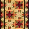 Luxury designer rug: rectangular quilted table runner with geometric star and diamond patterns in vibrant hues and a dark brown border.