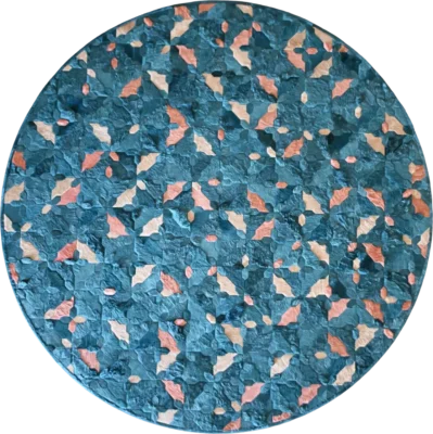 Luxury designer rug in round shape with abstract geometric patterns in blue, teal, pink, and peach.