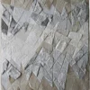 Abstract designer rug with geometric beige, gray, and off-white layers in luxury handmade wool.